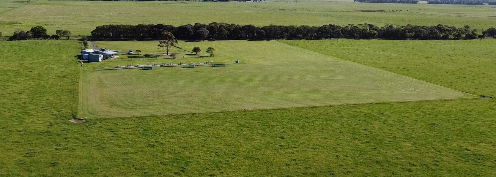 The BMAC clubhouse beside the mown grass runway